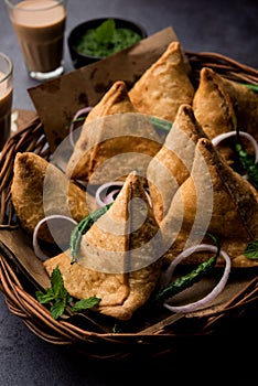 SamosaÂ Snack is an Indian deep fried pastry with a spiced filling usually made with potatoes, spices and herb